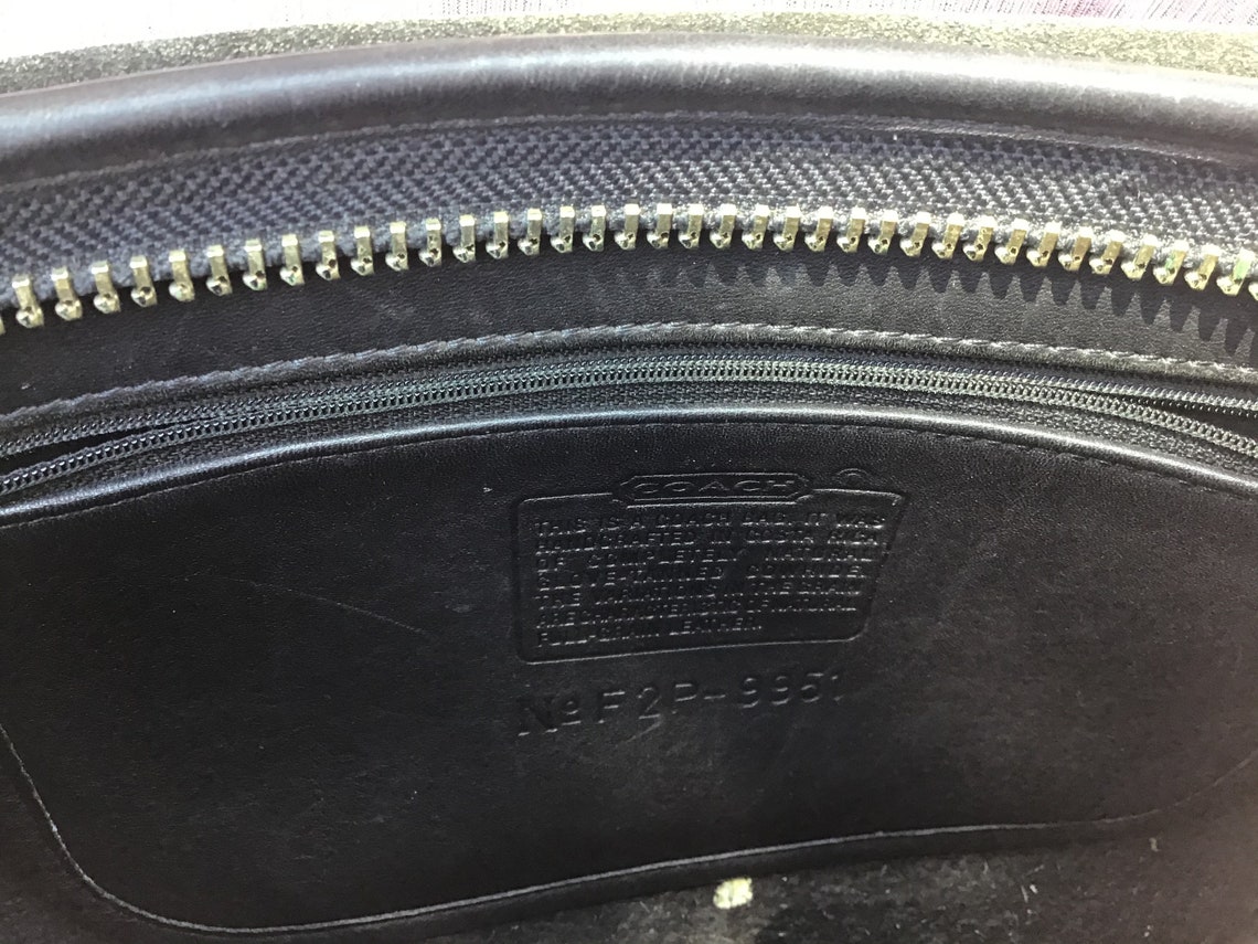 black coach saddle bag with horse and carriage