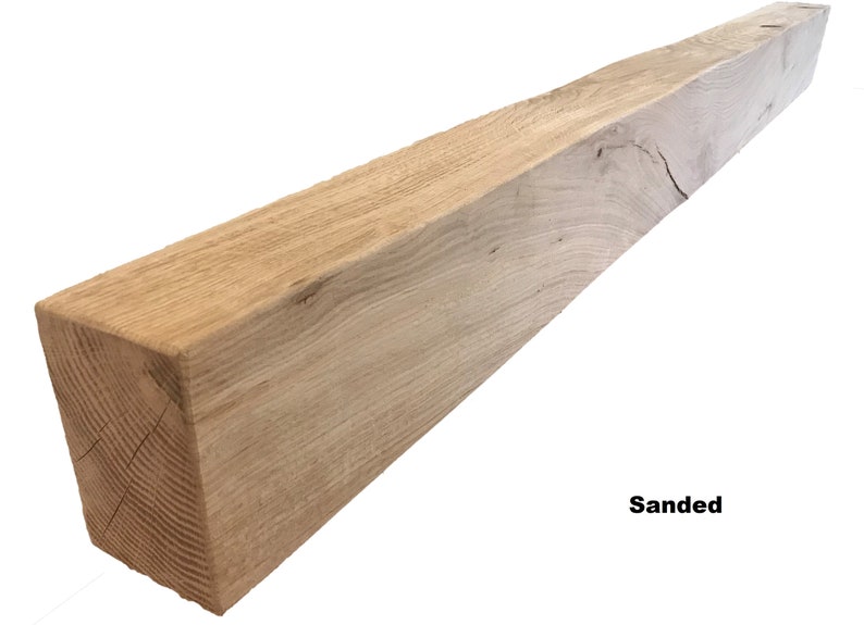May include: A sanded, light brown wooden beam. The beam is rectangular in shape and has a rough, natural texture. The beam is approximately 6 feet long and 6 inches wide.