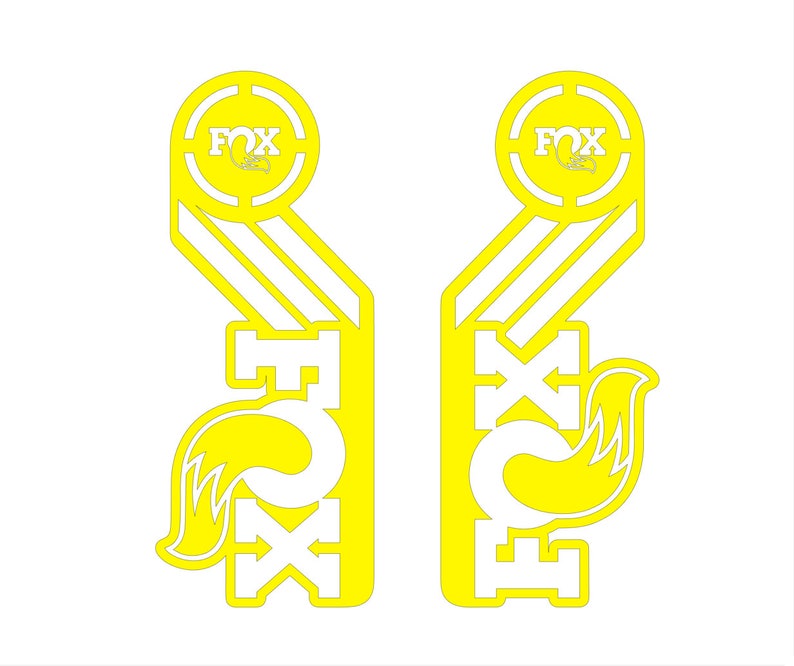 May include: A pair of yellow and white Fox Racing decals with a fox logo and the word "Fox" in a circle. The decals are designed to be placed on a motorcycle or other vehicle.