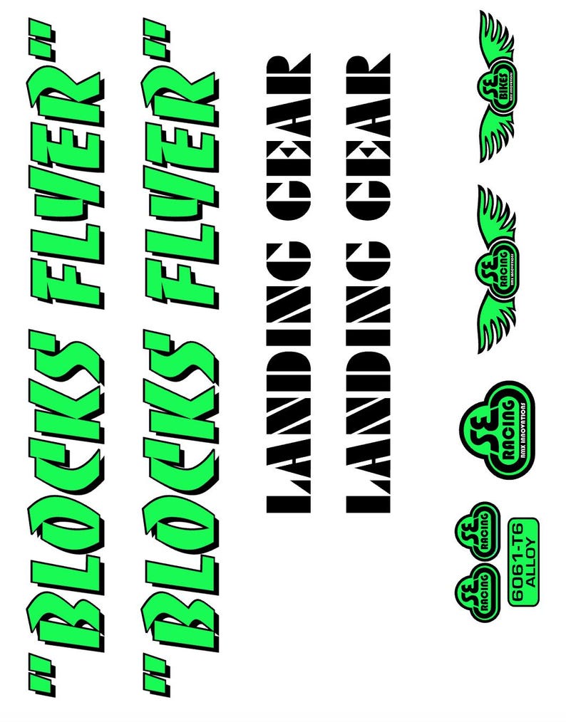May include: A collection of bicycle decals and logos. The decals feature the text "BLOCKS FLYER" in green, and "LANDING GEAR" in black. Several logos include the text "SE RACING" and "SE BIKES" with wing designs. The text "6061-T6 ALLOY" is also present.