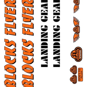 May include: A sheet of stickers with various designs and text. The words "BLOCKS FLYER" are in orange, stylized font. The words "LANDING GEAR" are in a black, blocky font. There are also several logos with wings and the text "SE RACING".