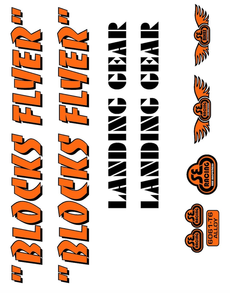 May include: A sheet of stickers with various designs and text. The words "BLOCKS FLYER" are in orange, stylized font. The words "LANDING GEAR" are in a black, blocky font. There are also several logos with wings and the text "SE RACING".