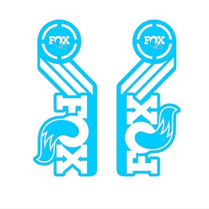 May include: A pair of blue and white decals with the word "FOX" and a stylized fox tail design.