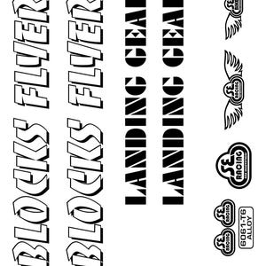 May include: Black and white graphic design featuring the text "BLOCKS FLYER" and "LANDING GEAR". Also includes SE Racing logos and "6061-T6 ALLOY" text. The design is suitable for stickers or decals.