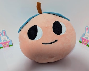 Peluche de melocotón maduro con ojos grandes y sonrisa de 30 cm