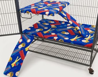 May include: A blue fabric cage liner set for small animals featuring a repeating baseball pattern with white baseballs, yellow gloves, bats, and red rectangular text labels that read BASEBALL and Ferret Zone, including a ramp and platform cover.
