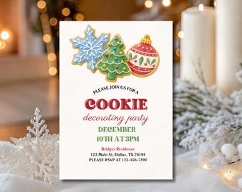 May include: A rectangular invitation card featuring illustrations of a blue snowflake, a green Christmas tree, and a red ornament cookie. The text reads: PLEASE JOIN US FOR A COOKIE decorating party DECEMBER 10TH AT 3PM Bridges Residence 123 Main St, Dallas, TX 76104 PLEASE RSVP AT 123-456-7890.