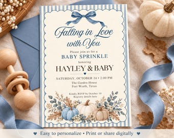 May include: A rectangular baby sprinkle invitation card with a scalloped edge and blue striped border. It features a blue watercolor bow at the top, text reading Falling in Love with You, and a bottom illustration of blue, white, and tan pumpkins.