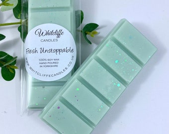 May include: A green wax melt with a white label that reads "Whitcliffe Candles Fresh Unstoppable 100% Soy Wax Hand Poured in Yorkshire www.whitcliffecandles.co.uk"