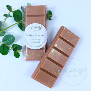 May include: Two brown wax melt bars with glitter accents. One is in a clear plastic wrapper. The label reads "Salted Caramel" and "100% Soy Wax, Hand Poured in Yorkshire" from Whitcliffe Aromas.
