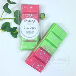 May include: Two wax melts, one green and one pink, with a white label that says "Whitcliffe Aromas Toffee Apple 100% Soy Wax Hand Poured in Yorkshire www.whitcliffe aromas.co.uk"