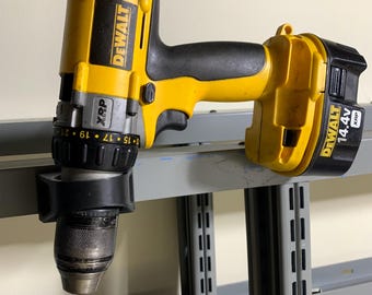 Magnetic drill holder with dual magnetic bracket holds 1/2” drill easily.