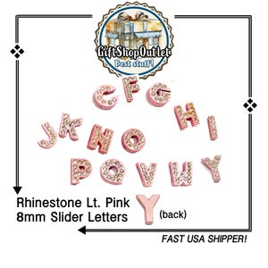 May include: A collection of light pink rhinestone slider letters, each 8mm in size, with sparkling crystal accents. The letters are displayed against a white background. The text "Gift Shop Outlet" and "Rhinestone Lt. Pink 8mm Slider Letters" are also visible.