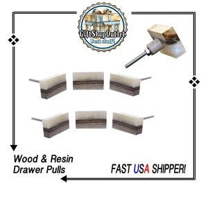 May include: A collection of wood and resin drawer pulls. Each pull features a rectangular design with a light-colored top layer, a dark brown middle layer, and a darker bottom layer. The text "Wood & Resin Drawer Pulls" is visible.