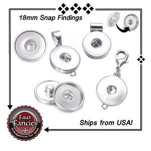 May include: A set of five silver 18mm snap findings, including a pendant, a charm, a clasp, and two separate snap pieces. The findings are all silver and have a smooth, polished finish.