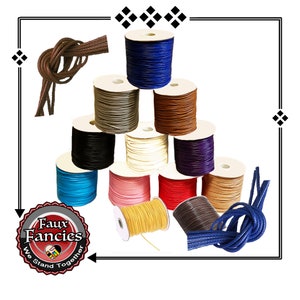 May include: A collection of eleven spools of colorful cord arranged in a pyramid shape, featuring shades of blue, brown, black, white, red, pink, yellow, and tan. Two loose knotted pieces of brown and blue cord are positioned at the corners.
