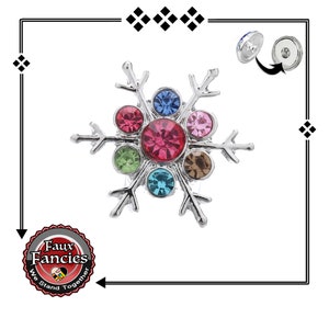 May include: A silver snowflake charm with colorful rhinestones. The charm is designed to be used with a magnetic snap button.