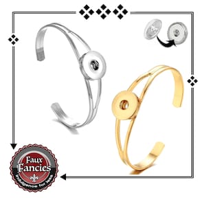 May include: Two snap button bracelets, one silver and one gold. The bracelets are made of metal and have a snap button closure. The snap buttons are removable and can be swapped out for different designs.