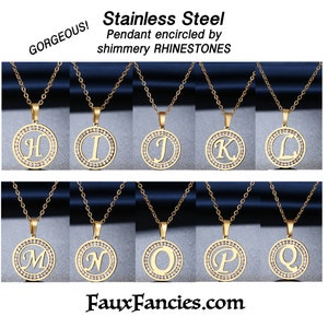 May include: Ten gold-toned stainless steel circular pendants on matching chains, each featuring a central letter from H to Q. The circular frame of every pendant is encrusted with clear, shimmery rhinestones. Text reads: Stainless Steel Pendant encircled by shimmery RHINESTONES, GORGEOUS!, and FauxFancies.com.