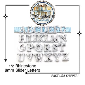 May include: A set of 26 silver-toned alphabet letter charms, each embellished with clear rhinestones. The letters are 8mm in size and are designed to be used as slider charms.