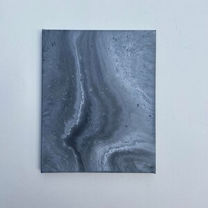May include: Abstract painting on canvas with gray and white swirling patterns.