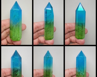 May include: Six blue and green crystal points with a layered effect. The points are arranged in two rows of three.
