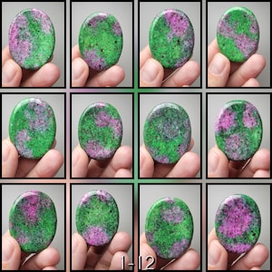 May include: A collection of twelve oval-shaped gemstones, each displaying a unique pattern of green and pink hues. The stones are held in hands, showcasing their natural textures and colors. The text "1-12" is visible at the bottom.