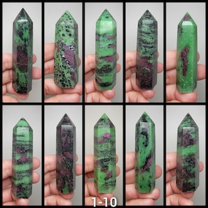 May include: Ten green and black gemstone points with pink and white inclusions. The points are polished and have a pointed tip. The points are arranged in two rows of five. The image is labeled "1-10".