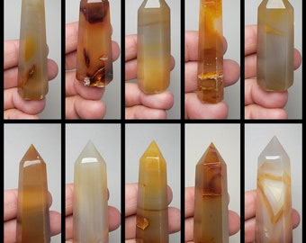 May include: Ten agate crystal points in various shades of brown, orange, and white. The points are arranged in two rows of five, with the text "1-10" at the bottom.