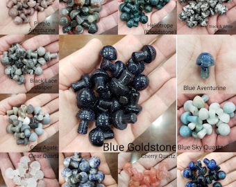 May include: Assortment of small mushroom-shaped crystal stones in various colors, including purple, black, gray, blue, and red. The stones are labeled with their names, such as "Purple Aventurine", "Black Lace Jasper", "Gray Agate Clear Quartz", "Blue Goldstone", "Blue Sky Quartz", "Cherry Quartz", "Denim Sodalite", and "Dyed Blue Tiger's Eye".