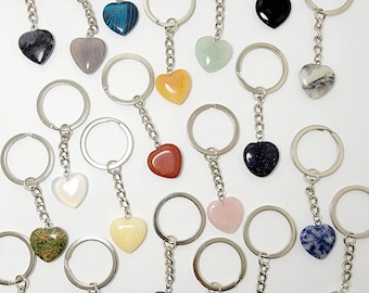 May include: Assortment of heart-shaped crystal keychains in various colors, including amethyst, agate, aventurine, carnelian, clear quartz, jasper, lapis lazuli, obsidian, opal, rose quartz, and turquoise.