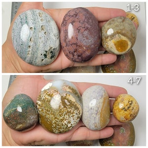 Puede incluir: Siete piedras pulidas con varios patrones y colores, incluyendo verde, marr&oacute;n, blanco, morado y amarillo. Las piedras est&aacute;n dispuestas en dos filas, etiquetadas 1-3 y 4-7.
