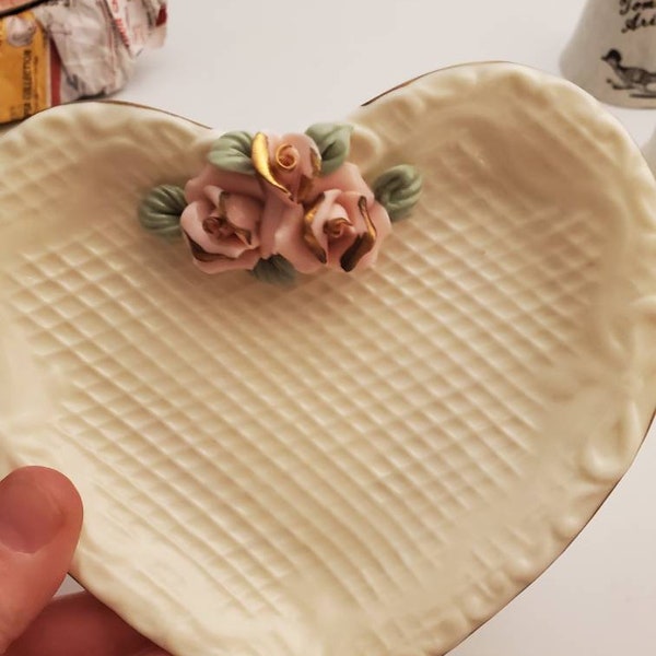 Vintage heart shaped trinket ring vanity dish! 3 D flowers pink with green leaves! Beige pink and gold trim! With original box! Crown Accent