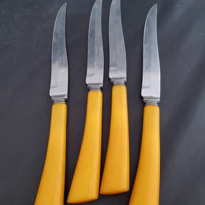 Vintage yellow bakelite Forger stainless steel serated knives! Mid century  knives set of 4!