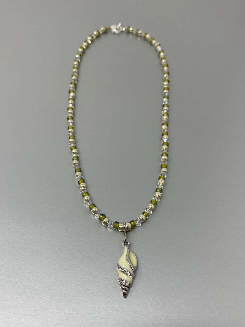 Shining Seas Necklace Sterling Silver Imitation Rhodium Plated Brass Glass Rhinestone Off White Olive Green Conch Seashell Nautical Gift