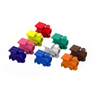 May include: A collection of colorful toy train figurines in various colors, including red, yellow, pink, blue, green, white, brown, and orange. Each train has a locomotive and a small roof, set against a white background.