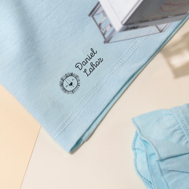 Self Inking Stamp for Clothes being used on a blue shirt