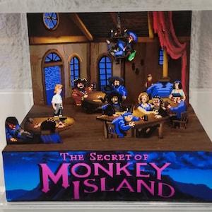 Diorama del cubo de la barra de la escoria de la isla de los monos