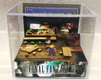 May include: A 3D diorama of a scene from Final Fantasy VII, featuring Cloud and Tifa in a bar. The diorama is made of paper and is displayed in a clear acrylic case. The text "FINAL FANTASY VII" is printed on the base of the diorama. Tifa says "You forgot the promise, too."