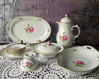 Alt Fürstenberg 'Pink Rose' porcelain dinnerware set, including teapot, candlestick, butter dish, bread basket, platter, and candy dish. Please select your style.