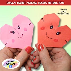May include: Two origami hearts with smiling faces, one pink and one red, are being held by hands. The hearts are folded in half and have a secret message inside. The image includes the text "Origami Secret Message Hearts Instructions" and "Includes Video Instructions".