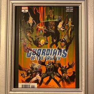 May include: A comic book cover featuring a group of superheroes in a colorful, action-packed scene. The cover is titled "Guardians of the Galaxy" and features the Marvel logo. The comic book is issue number 6.
