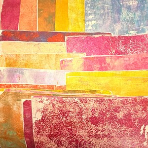May include: Abstract artwork featuring layered rectangular shapes in various colors. The color palette includes shades of red, pink, yellow, orange, and blue. The textures vary, with some areas appearing smooth and others textured.
