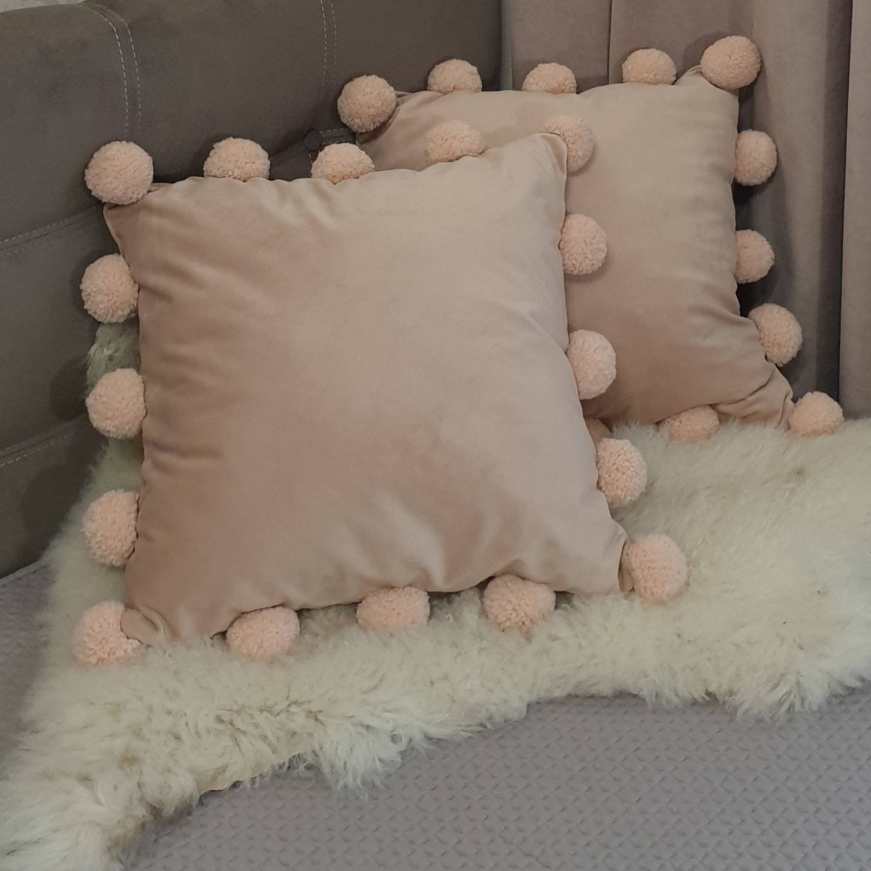 Blush pink pom pom cushion hotsell