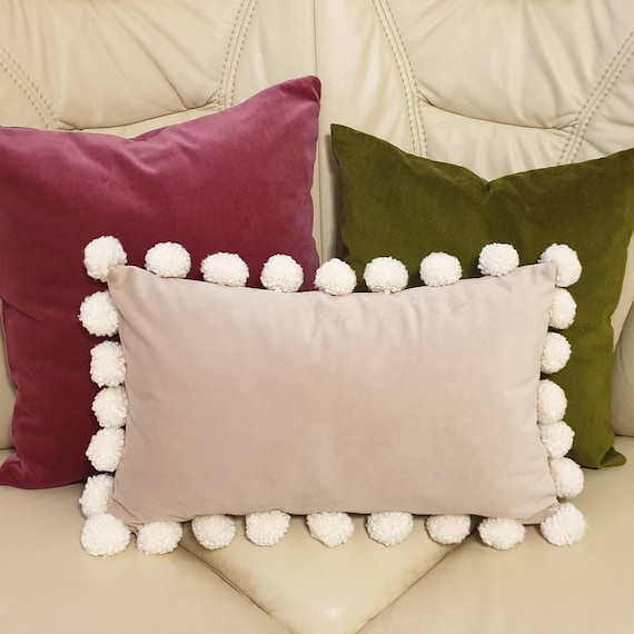 Blush pink pom pom cushion hotsell