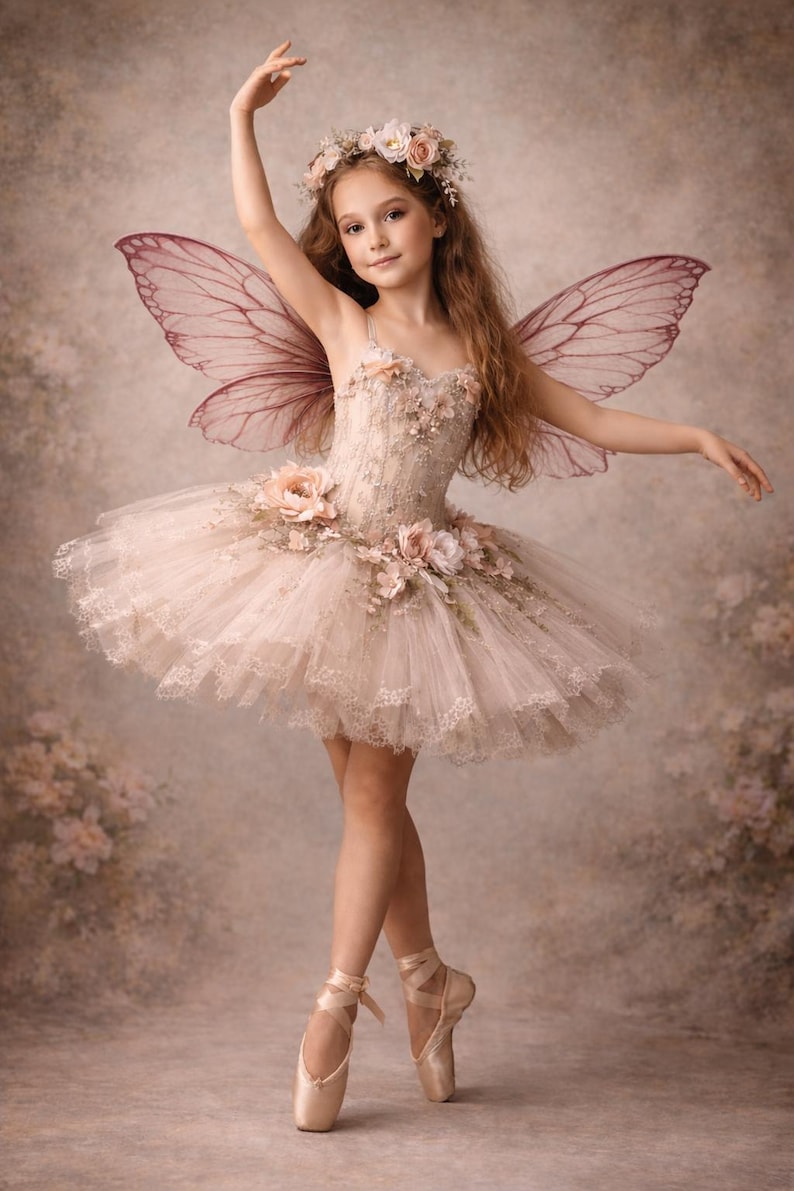 May include: A young person in a fairy costume, with a floral crown and delicate wings. The outfit includes a detailed bodice and a layered tutu skirt. The ballet shoes are a soft pink, and the background is a muted, floral-themed backdrop.