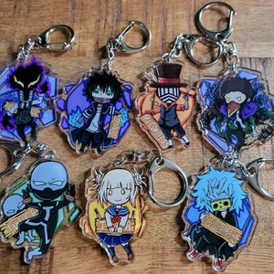 May include: Set of 8 anime character keychains featuring characters from the My Hero Academia series. The keychains are made of clear acrylic and feature colorful illustrations of the characters. The characters include: Twice, Shigaraki, Dabi, Mr. Compress, Toga, and others.