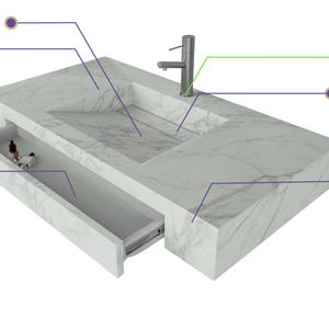 Puede incluir: Una encimera de lavabo con patr&oacute;n de m&aacute;rmol blanco, fregadero de rampa integrado, grifo de acero inoxidable y un caj&oacute;n abierto. Las etiquetas indican caracter&iacute;sticas: Integrated Ramp Sink, Seamless Mitered Edge, Customizable Faucet Holes, Removable Drain, Modify with Add-Ons y Water Edge Design.