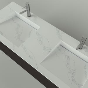 May include: A modern, double-sink vanity with a white marble-look countertop. The countertop features two rectangular integrated sinks and two chrome faucets. The vanity has a dark brown base and is set against a light gray background.