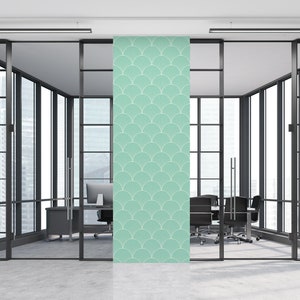 May include: A teal blue wallpaper with a repeating pattern of white stylized fans. The wallpaper is shown in a modern office setting.